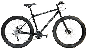 Motobecane fat bike with aluminum frame, disc brakes, and wide tires for all-season riding