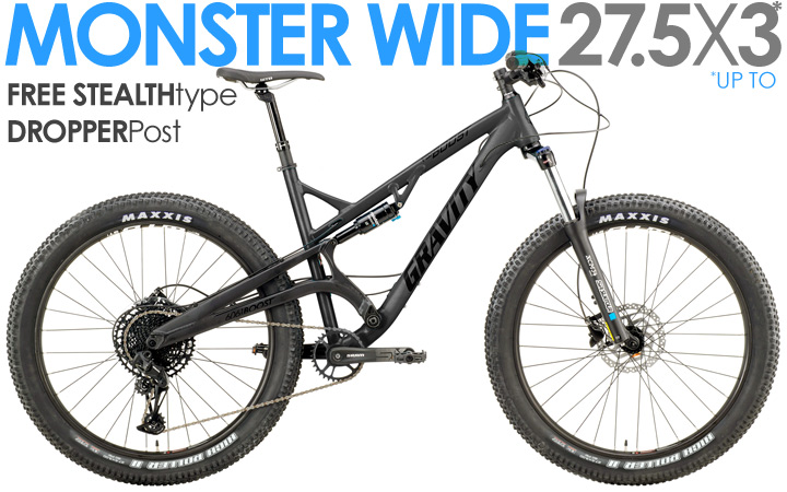 Full suspension trail mountain bike with wide tires designed for improved traction and stability on rugged terrain