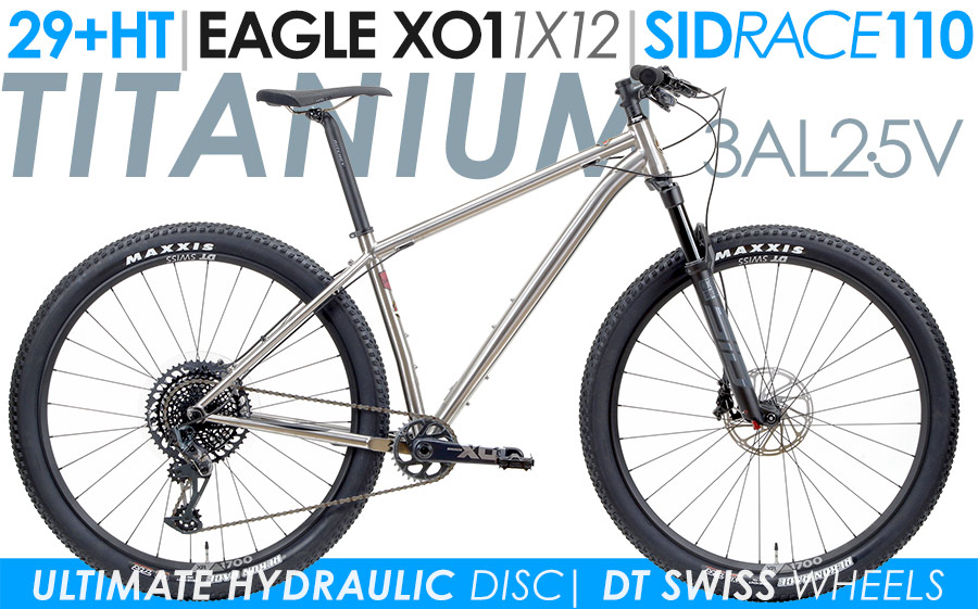 Titanium hardtail mountain bike with front suspension fork built for efficient trail climbing and cross-country riding