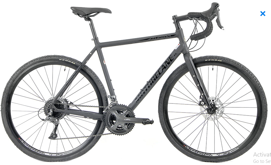 Motobecane Turino Elite XTL disc brake road bike featuring aluminum frame, carbon fork, drop handlebars, and wide tire clearance designed for endurance road riding and mixed terrain