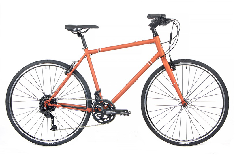 Step thru hybrid gravel commuter bike with flat handlebars and comfortable geometry for city riding