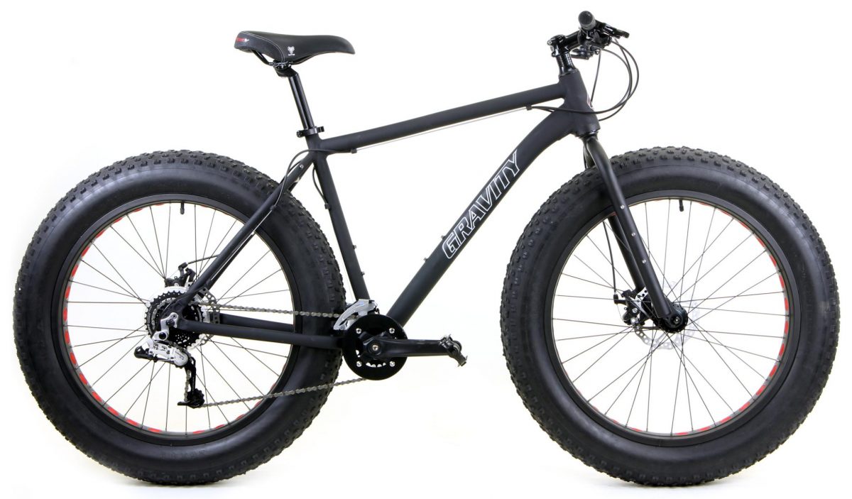 Fat-tire bike with oversized tires and rugged frame built for rough surfaces