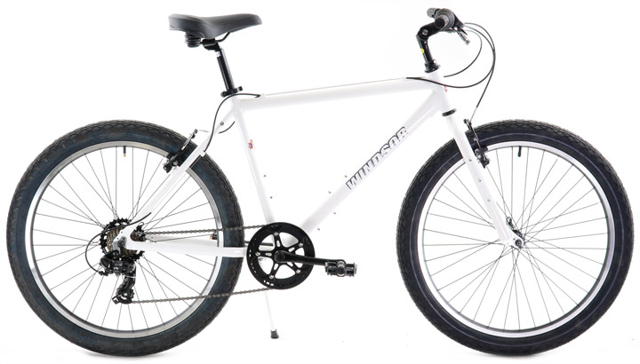 White hybrid commuter bicycle with rim brakes designed for everyday urban riding